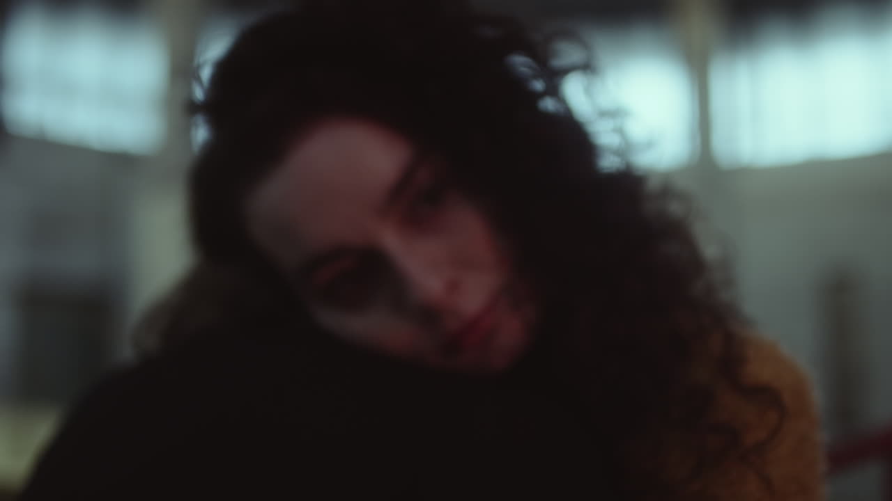 Pensive Woman Under Red Light