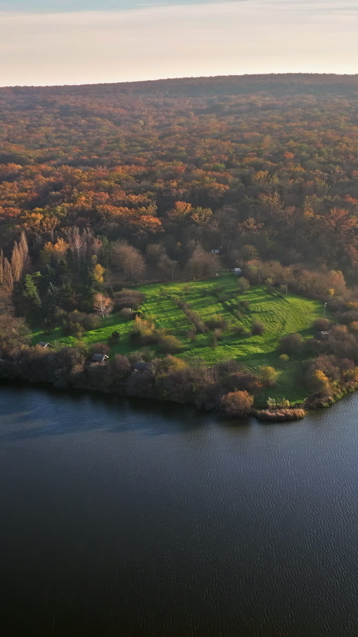 Aerial drone view of a small island on the Raut river near Orhei, Moldova. Vertical