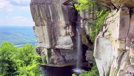 water flowing over lovers leap waterfall at rock city park and lookout mountain in georgia, usa
