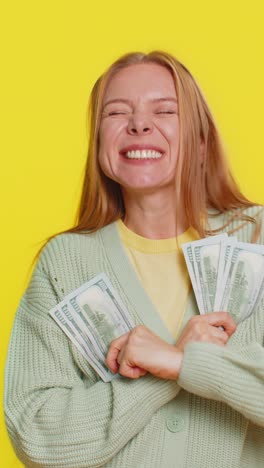 rich happy woman winner waving money dollar cash like a fan big income wealth success business