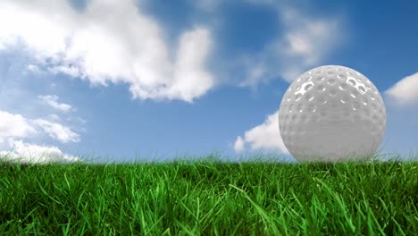 Animation-of-golf-ball-on-grass-over-cloudy-sky