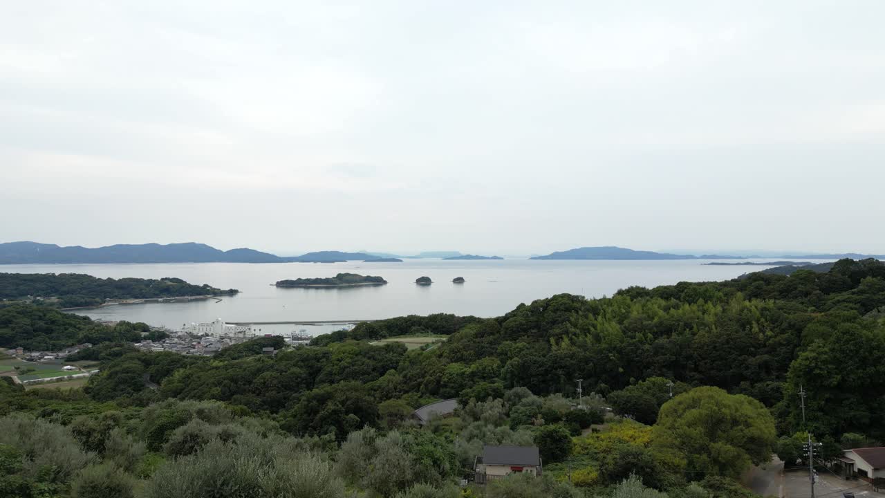 Slow motion drone flight over Ushimado port town in rural Japan