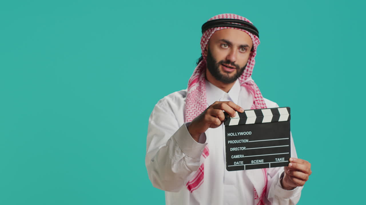 Middle eastern guy with clapboard