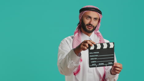 Middle-eastern-guy-with-clapboard