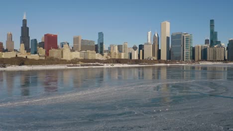 Low-Aerial-View-of-Chicago-Skyline-from-Lake-Michigan-on-Freezing-Cold-Day-in-Winter