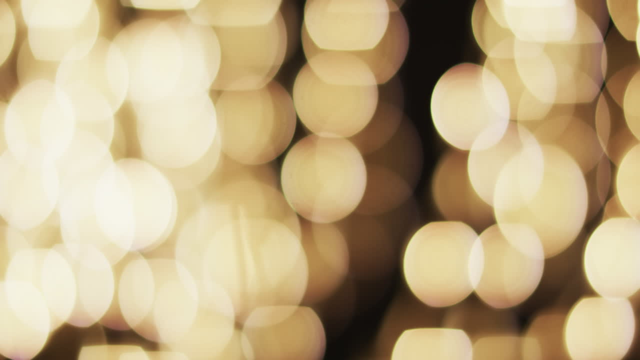 video de puntos de luz bokeh amarillos parpadeantes con espacio de copia
