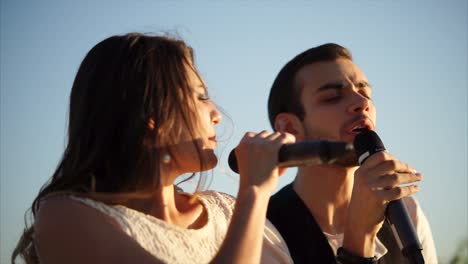 couple singing outdoors
