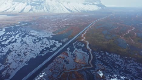 river estuary near snowy mountains