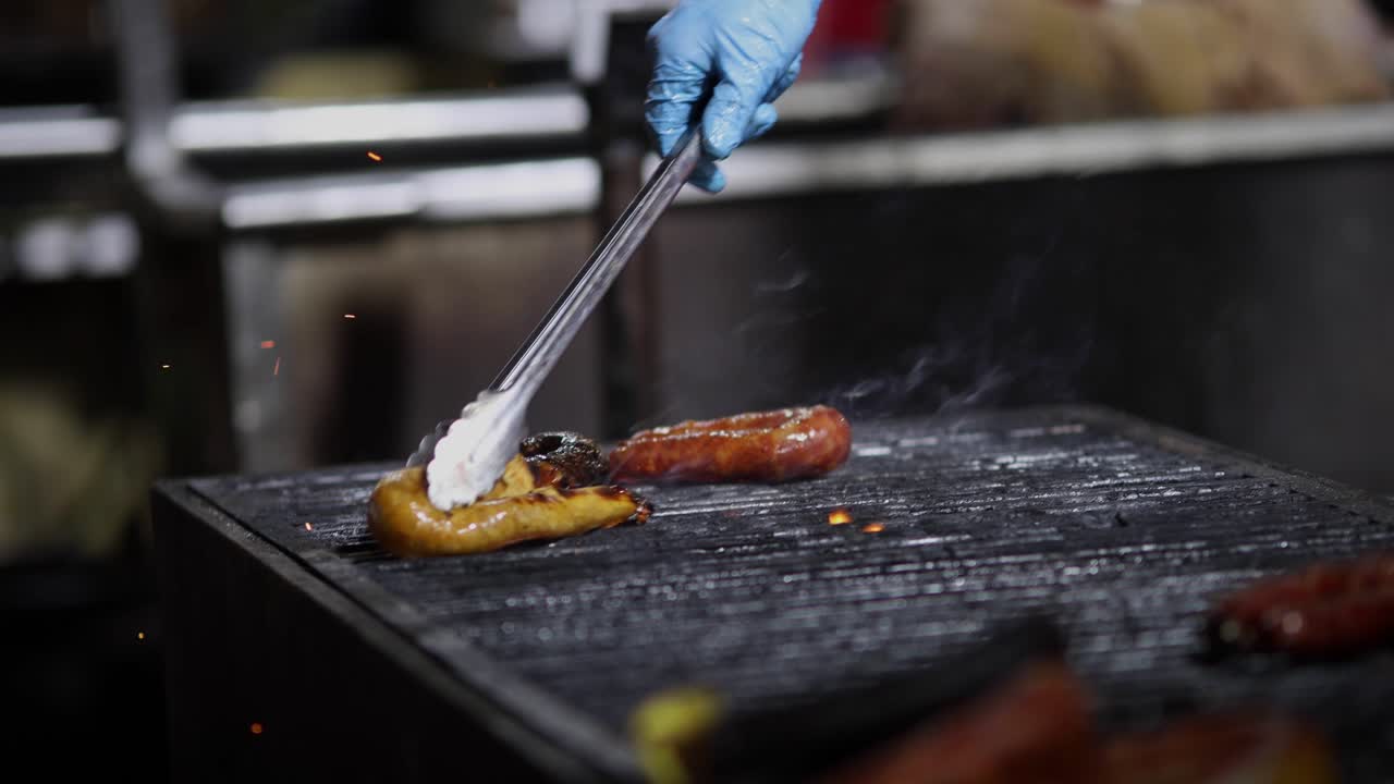 Street Food. Portuguese traditional spicy sausage being barbecued over hot charcoal fire