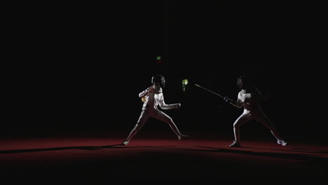 two fencers compete in a match.