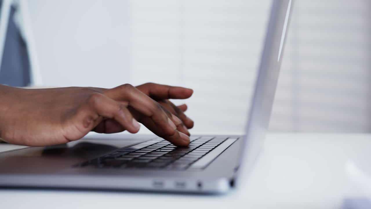 Person Typing on a Laptop