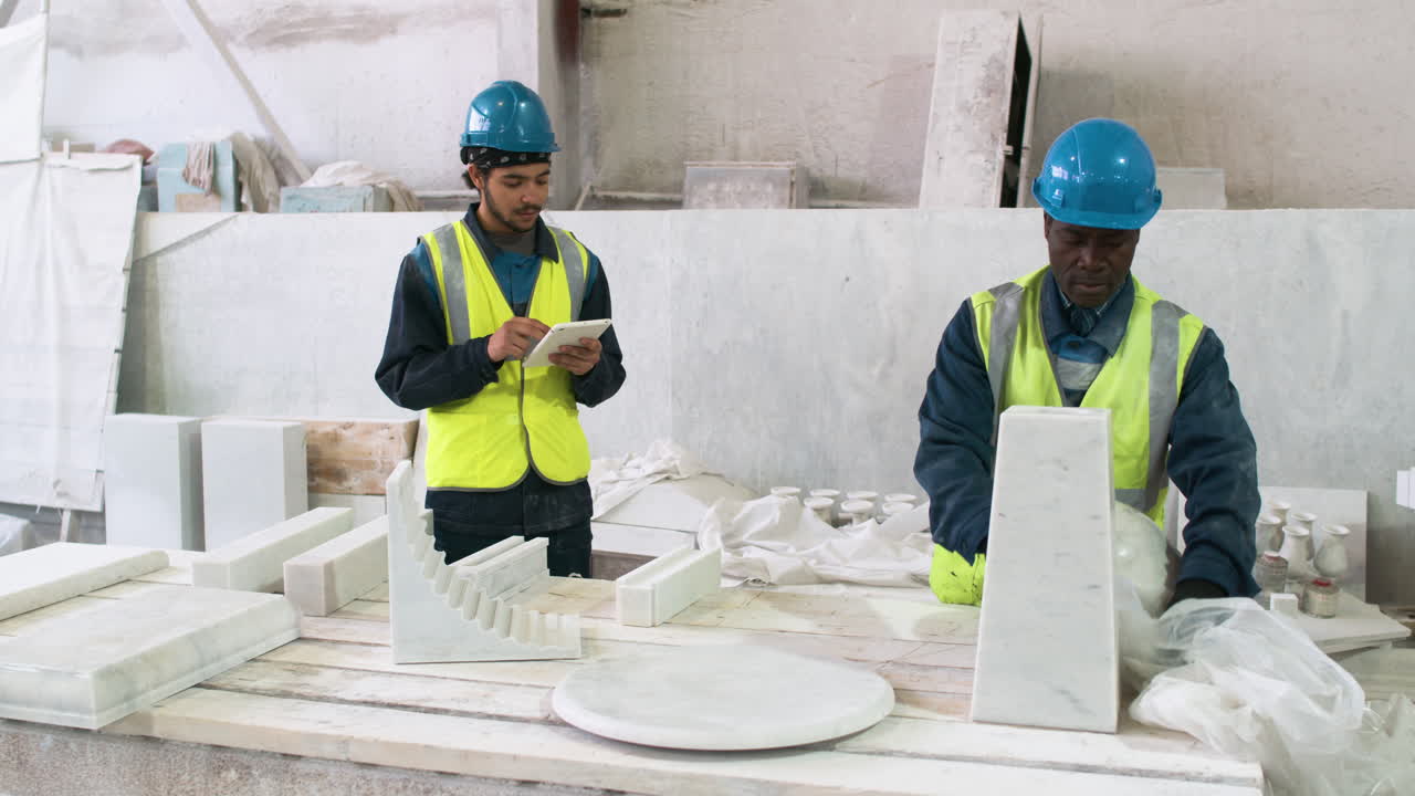 Workmates in a marble factory