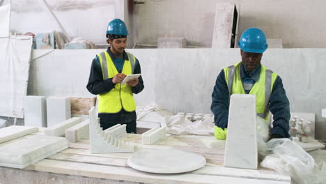 workmates in a marble factory