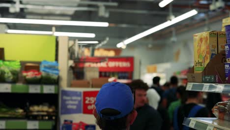 shoppers navigate aisles with cereal offers