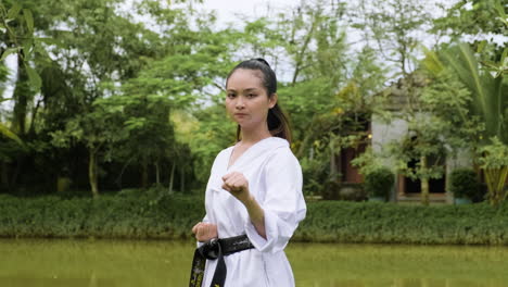 young woman practising taekwondo