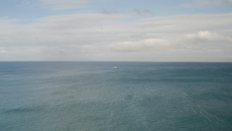 4K-aerial-of-distant-fishing-boat-in-Monterey-Bay-California