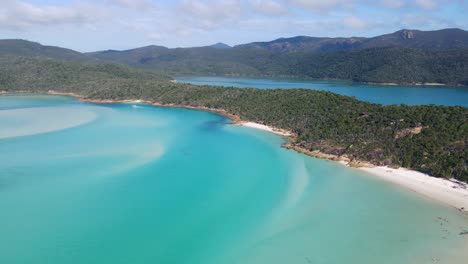 White-shallow-waters-of-the-Whitehaven-Beach-in-Queensland,-Australia--Aerial