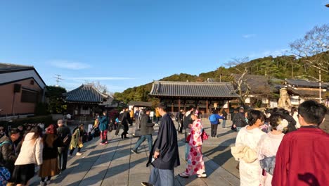 crowds exploring a traditional japanese temple