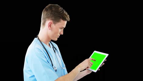 male surgeon using digital tablet