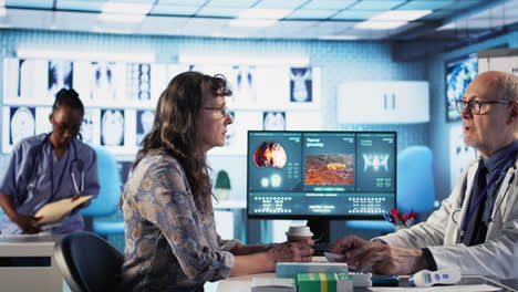 vertical video healthcare expert examine cancer screening scan discussing preventative measures