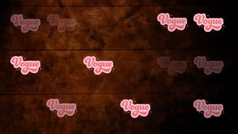 Animation-of-vogue-text-repeated-on-wooden-background