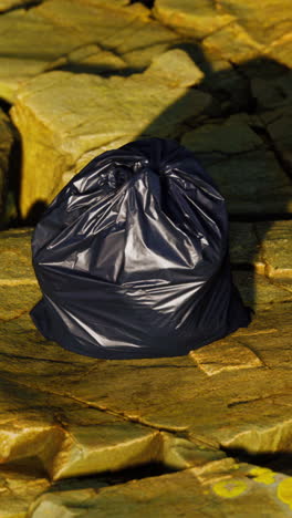 garbage bag on rocks