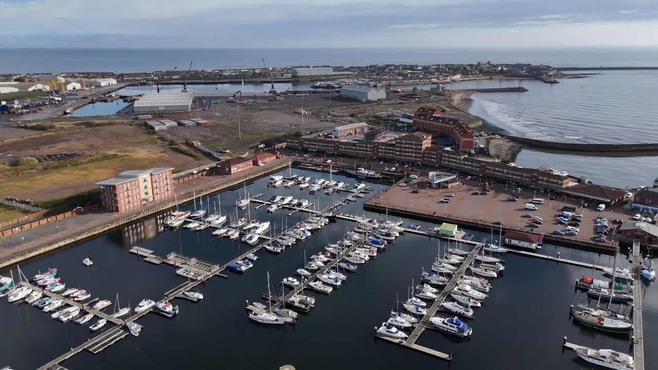 Aerial drone video Hartlepool marina harbour port beach coastal town County Durham North East England UK