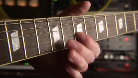 playing lead on the electric guitar at the recording studio