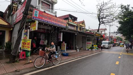 traffic and daily life on a rural vietnamese street