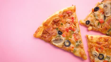 pizza slices on pink background