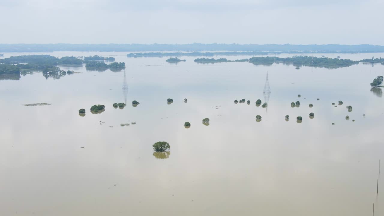 Aerial view of flood across Bangladesh village submerged property monsoon affected devastation community