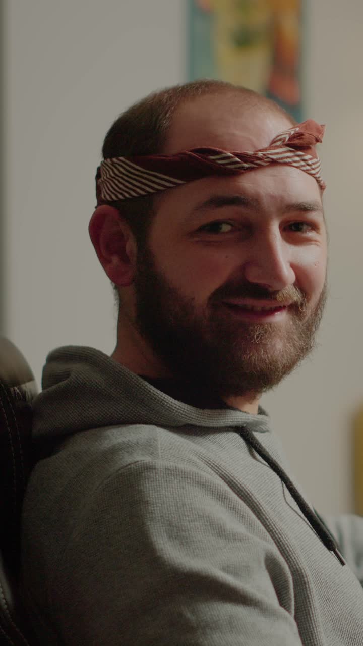 Portrait of a man with a beard and bandana
