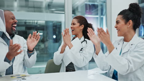 celebrating success: a team of doctors applause in jubilation