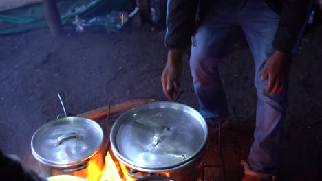 Noodles-and-rice-cooking-on-the-fire-on-top-of-the-vocal-in-Antigua,-Guatemala