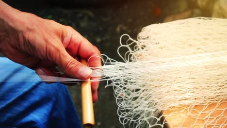 fisherman is repair the fish net