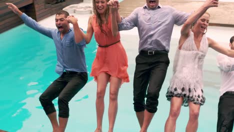 happy friends playing in the swimming pool