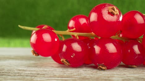 Super-close-macro-of-a-redcurrants-on-a-wooden-table.