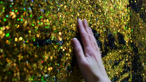 close-up view of a gold glitter sequin fabric