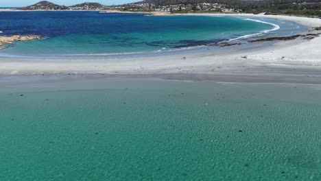 aerial flyover turquoise water of ocean in tasmania