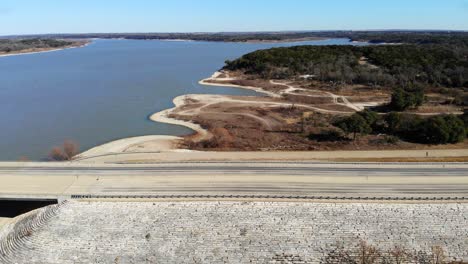 Flying-at-medium-height-over-the-road-where-it-ceases-to-be-land-and-turns-into-the-bridge-section