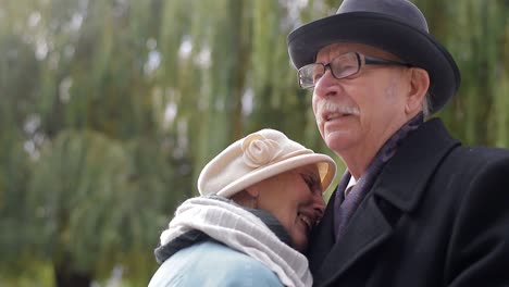 old european man and woman dancing together in park standing old european man and woman dancing together in park standing healthy lifestyle concept