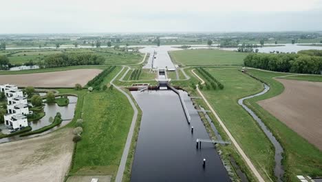 Aerial-footage-of-the-canal-and-suburban-in-the-Netherlands