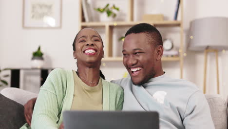 Laptop,-movie-and-black-couple-laugh-on-a-living