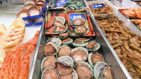 fresh seafood on display at market stall