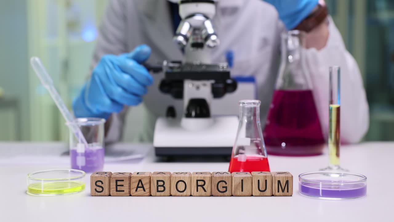 Scientist in a lab conducting research with a microscope and chemical solutions, featuring 'Seaborgium' spelled out