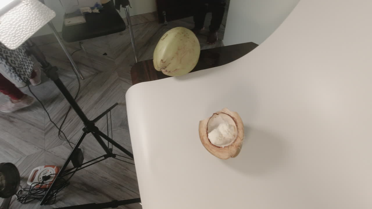 Indian Photographer adjusting camera in a studio setting for slow-motion capture