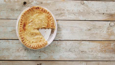 Video-of-pie-seen-from-above-on-wooden-background