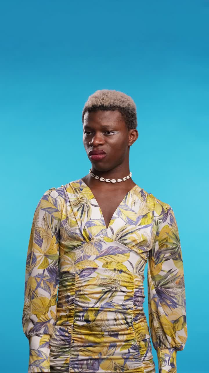 Displeased black gay man gesturing thumb down