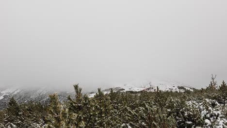 Cloudy-mountain-peak-timelapse,-people-on-a-trail,-mount-Sniezka-,-Poland