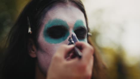 applying sugar skull makeup